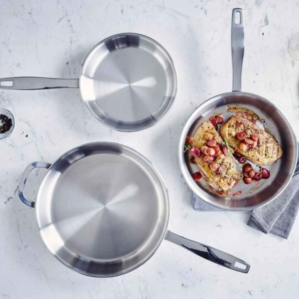 Alva Cookware 5-ply stainless steel frying pan with ergonomic handle, ideal for versatile stovetop cooking.