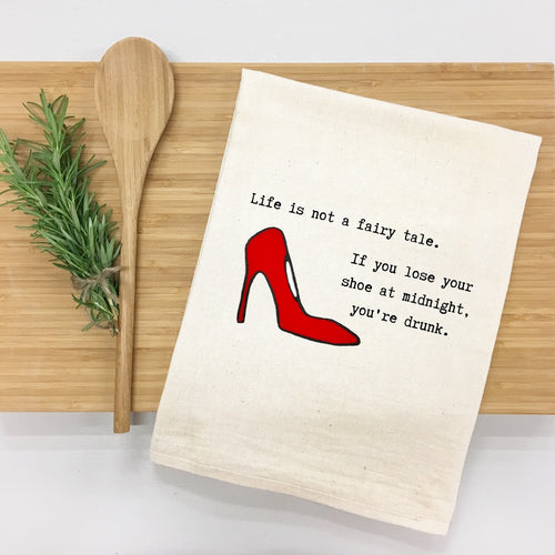 "Life is not a fairy tale. If you lose your shoe at midnight, you’re drunk." Kitchen Towel (Textiles) product photo