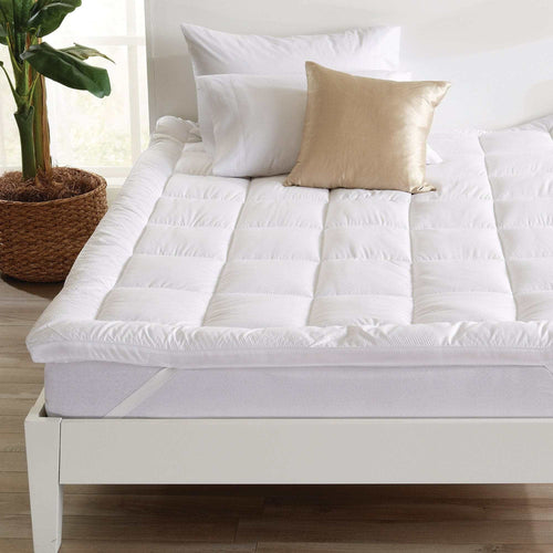 2 Inch Thick Mattress Topper from Restful Sleep Collection on bed with elastic straps and soft padding