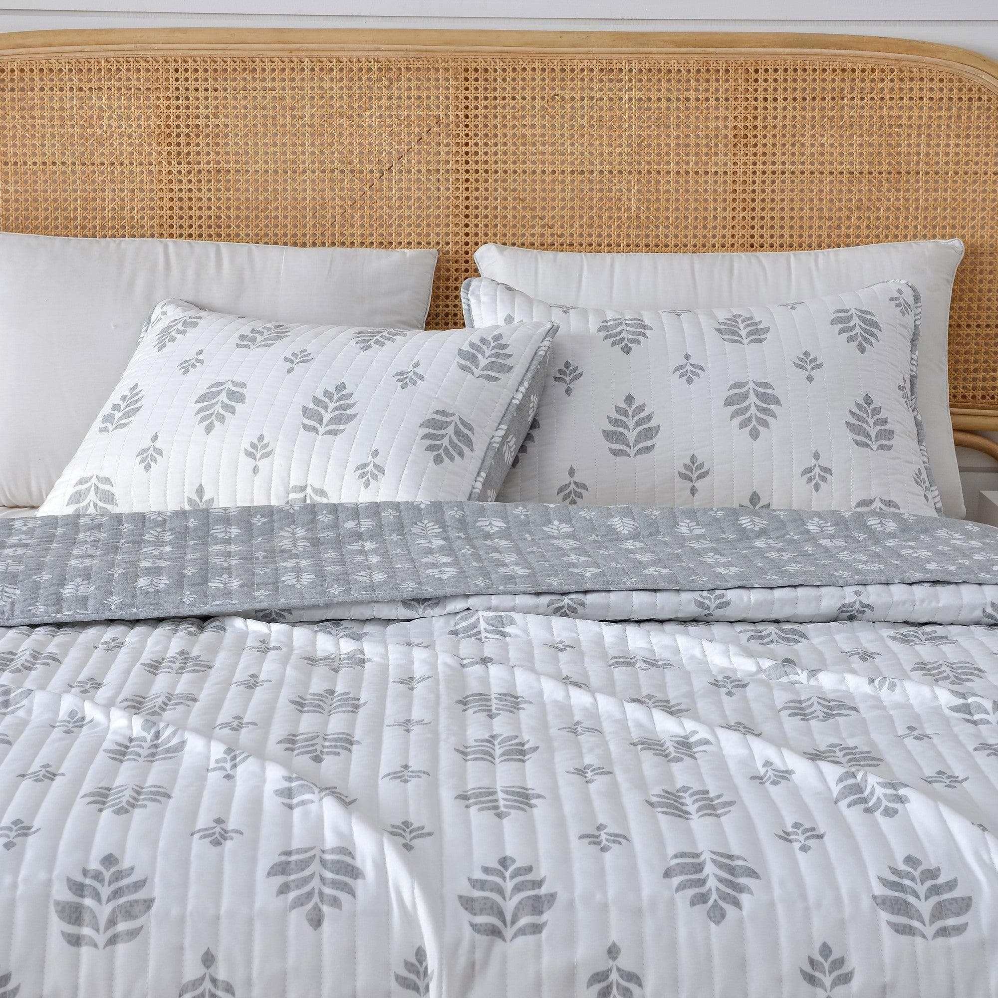 Soft French floral quilt from Colette Collection on bed