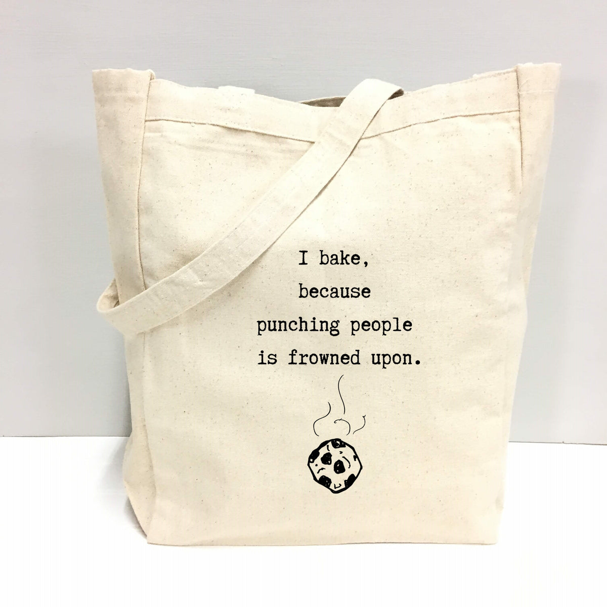 "I bake, because punching people is frowned upon." Tote Bag