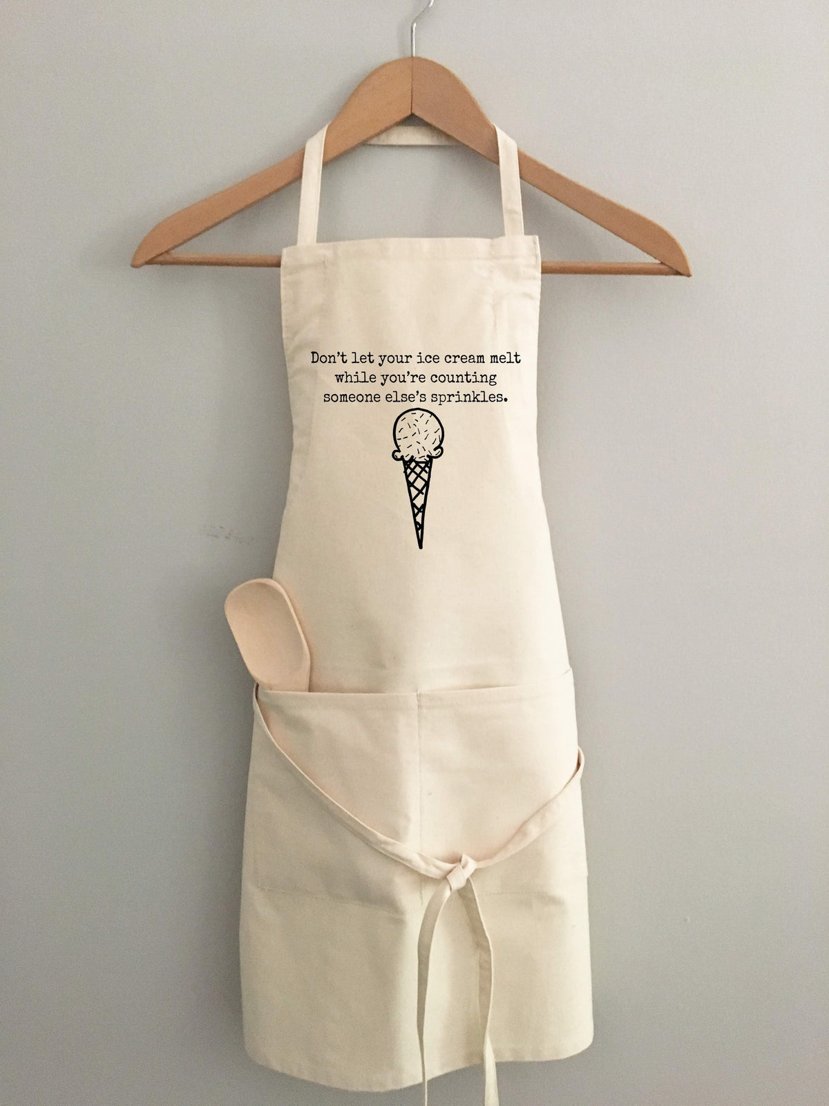 "Don't let your ice cream melt while you're counting someone else's sprinkles." Apron